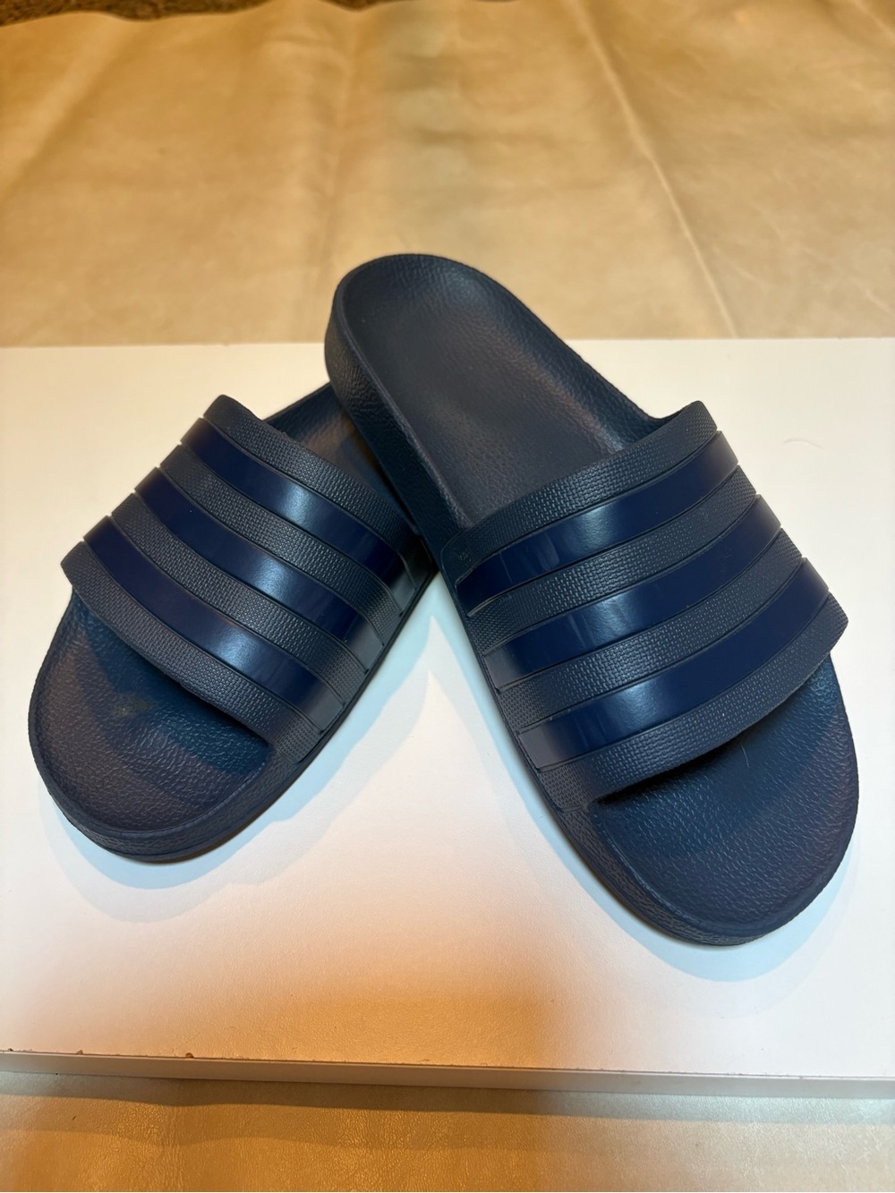 Adidas Adilette like new, worn once rubber slide . Color is navy.